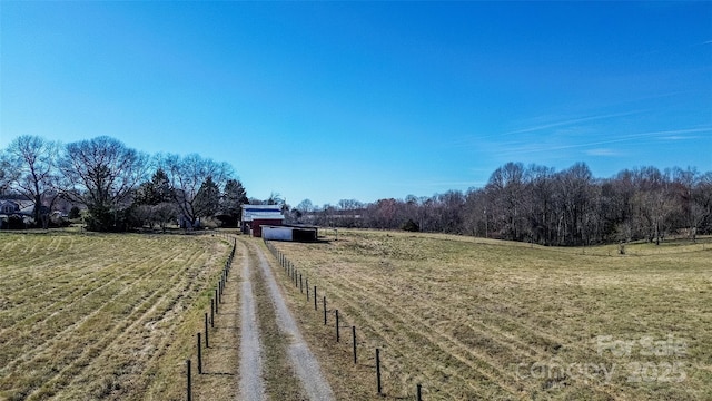 view of street featuring driveway and a rural view