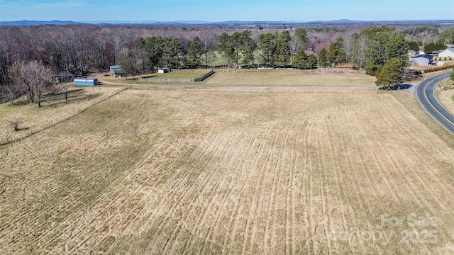 drone / aerial view with a rural view and a forest view