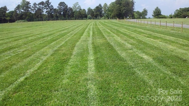 view of yard with a rural view