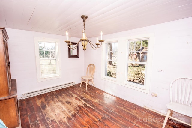 unfurnished room featuring wood ceiling, a notable chandelier, baseboard heating, and hardwood / wood-style flooring