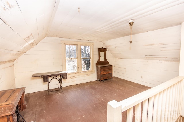 bonus room featuring vaulted ceiling, wood ceiling, hardwood / wood-style flooring, and wooden walls