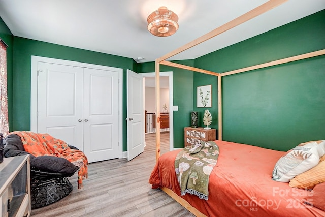 bedroom with a closet and wood finished floors