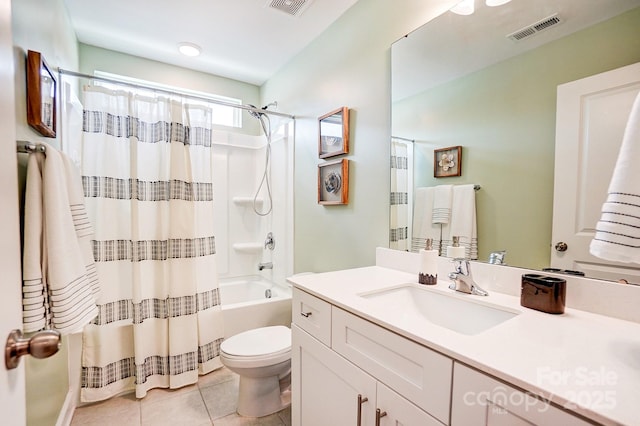 full bath featuring shower / bath combination with curtain, visible vents, toilet, vanity, and tile patterned flooring