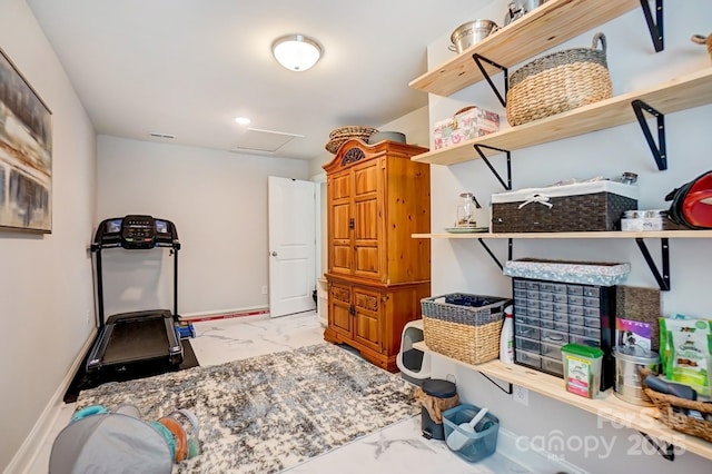 exercise room featuring marble finish floor, attic access, visible vents, and baseboards