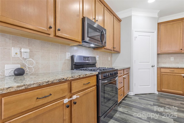 kitchen with light stone counters, stainless steel appliances, dark wood-type flooring, decorative backsplash, and crown molding