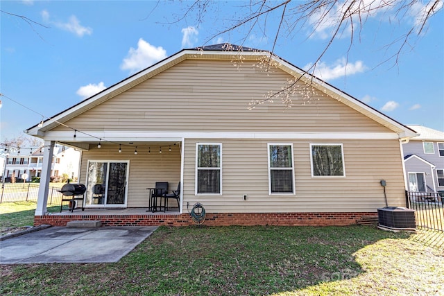 back of house with a patio, a lawn, fence, and central air condition unit