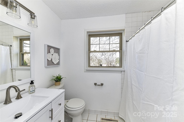 full bath featuring visible vents, toilet, a textured ceiling, tile patterned flooring, and vanity