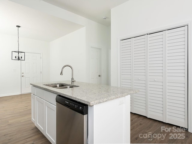 kitchen with white cabinetry, dishwasher, a sink, and wood finished floors