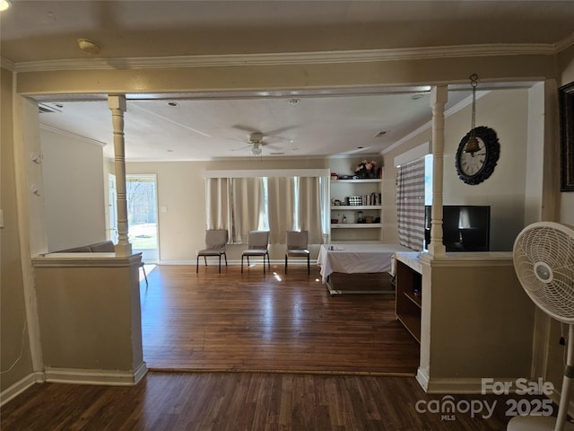 living area featuring ceiling fan, ornamental molding, wood finished floors, and baseboards