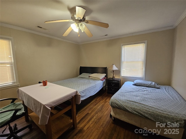 bedroom with a ceiling fan, crown molding, visible vents, and dark wood-type flooring