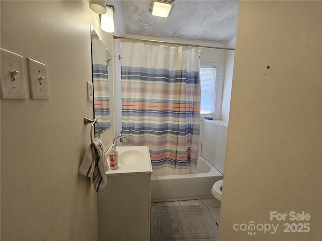 bathroom with toilet, tile patterned floors, shower / tub combo with curtain, and vanity