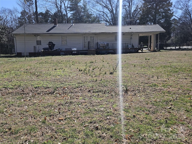 exterior space with french doors and a front yard