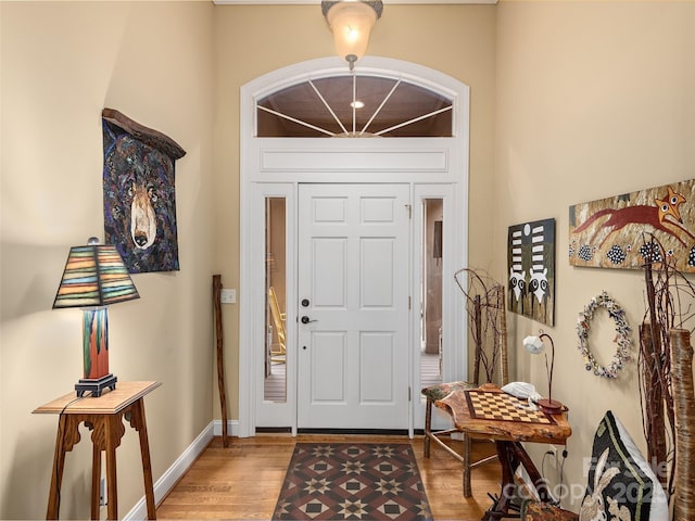 entrance foyer with light wood finished floors and baseboards