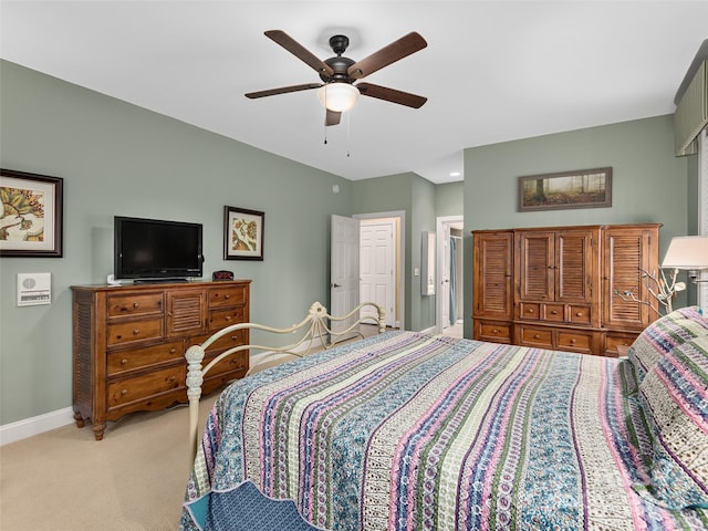 bedroom with baseboards, ceiling fan, and light colored carpet