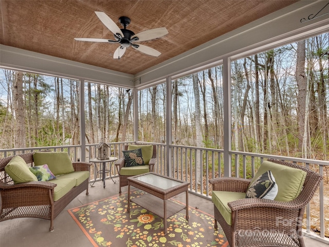 sunroom / solarium with ceiling fan