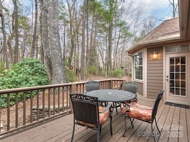 deck with outdoor dining area