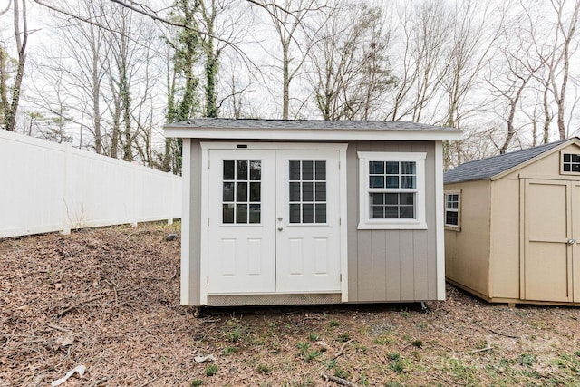 view of shed with fence