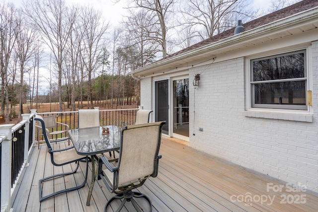 deck with outdoor dining area