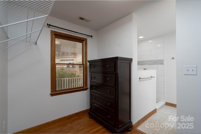 interior space featuring visible vents and light wood finished floors