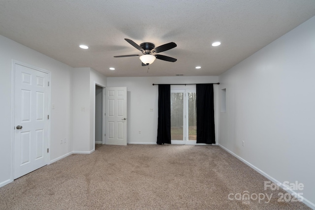 unfurnished bedroom featuring baseboards, a textured ceiling, carpet, and access to outside