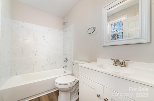 bathroom featuring  shower combination, wood finished floors, vanity, and toilet