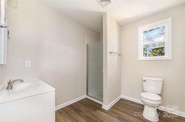2206 Hillcrest Ave, Albemarle, NC 28001 - bathroom featuring wood finished floors, a shower with door, and vanity