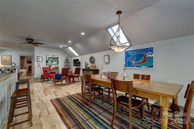 dining space featuring lofted ceiling, light wood-style floors, a ceiling fan, and recessed lighting