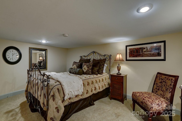 bedroom with carpet and baseboards