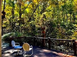 deck featuring a view of trees