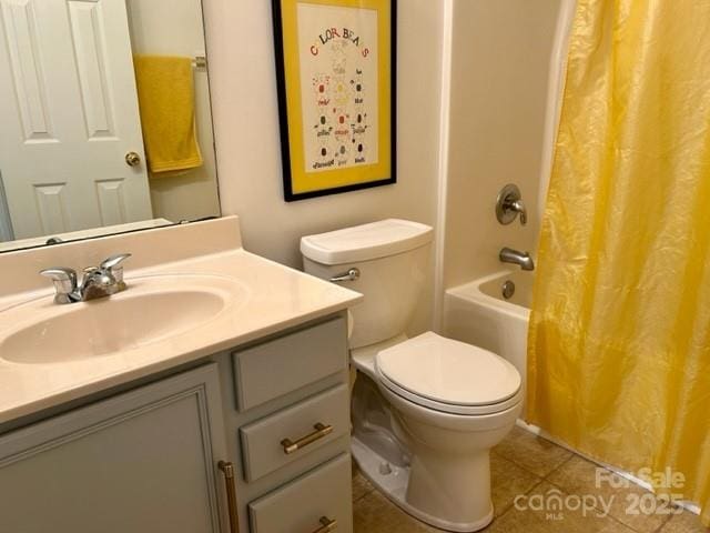 bathroom with tile patterned flooring, shower / bathtub combination with curtain, vanity, and toilet