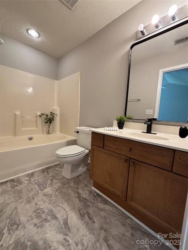 bathroom with a textured ceiling, visible vents, shower / bathtub combination, toilet, and vanity