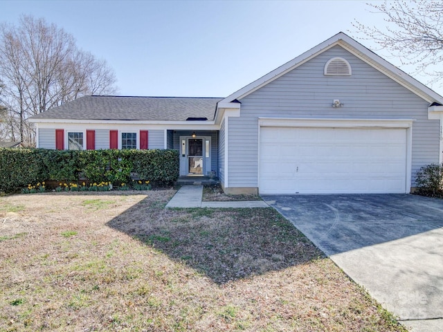 ranch-style house with a garage and concrete driveway