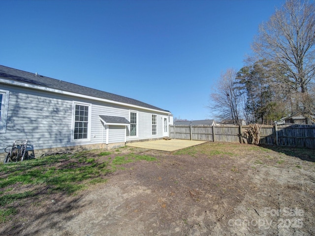 rear view of property with fence