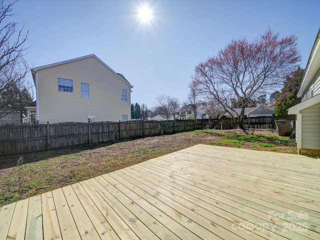 deck with a fenced backyard