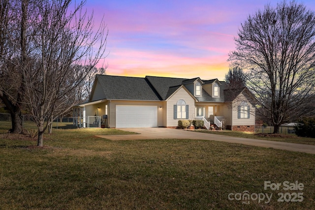 view of front of house with driveway, a shingled roof, crawl space, an attached garage, and a yard