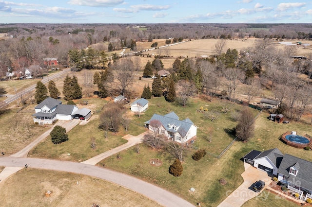 birds eye view of property with a rural view