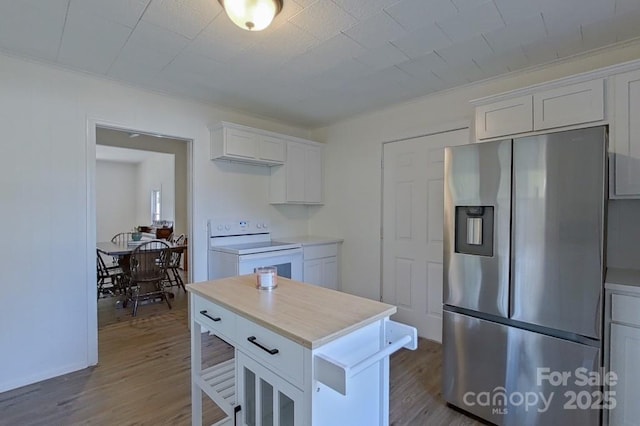 kitchen featuring light countertops, dark wood-type flooring, white electric range, and stainless steel fridge with ice dispenser