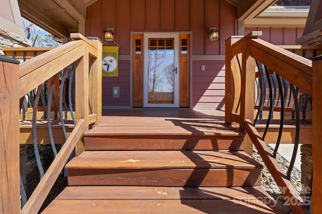 view of exterior entry featuring board and batten siding