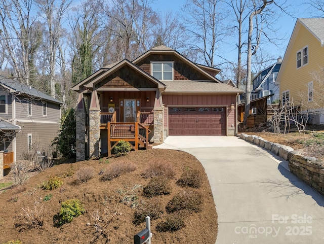 craftsman-style house featuring driveway, roof with shingles, stone siding, a garage, and board and batten siding