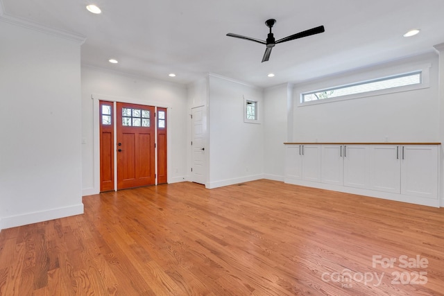 foyer entrance featuring baseboards, recessed lighting, ceiling fan, ornamental molding, and light wood-type flooring