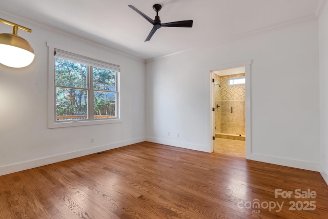 unfurnished room featuring crown molding, ceiling fan, and wood finished floors