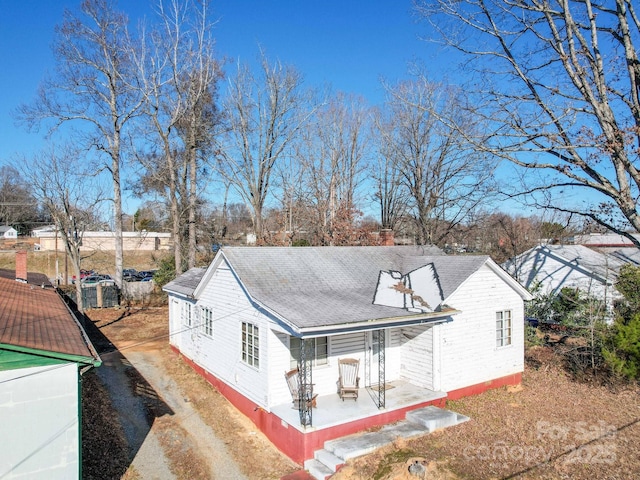 rear view of property with a porch