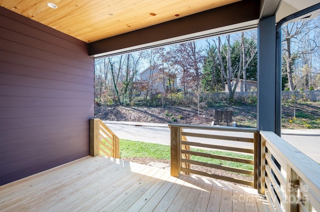 wooden deck featuring fence