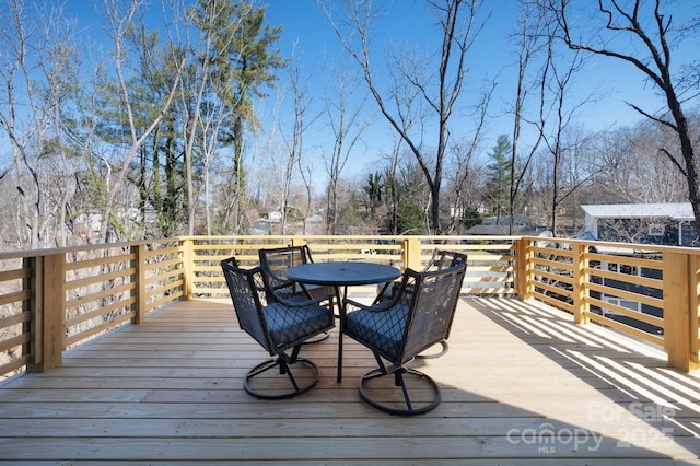 deck featuring outdoor dining space