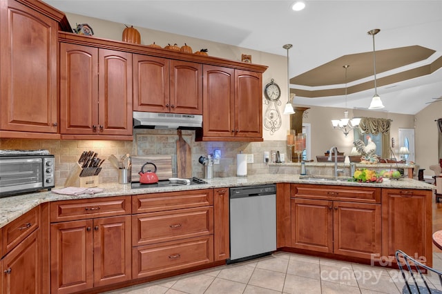 kitchen featuring a toaster, a sink, cooktop, under cabinet range hood, and stainless steel dishwasher