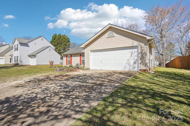 view of front of property with a front yard, an attached garage, and driveway