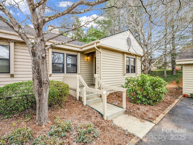 view of front of house featuring a shingled roof