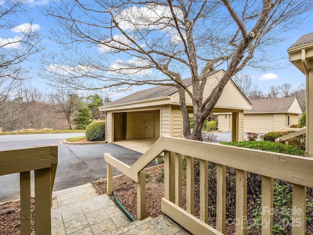 view of patio featuring a garage and driveway