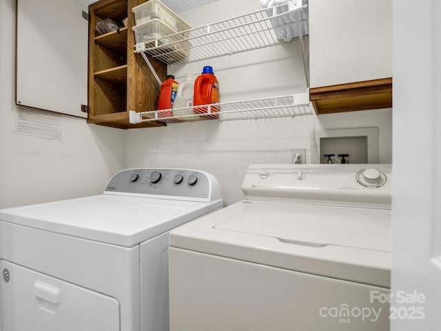 laundry area featuring cabinet space and washer and dryer