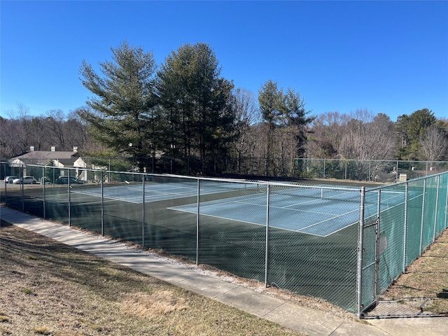 view of sport court with fence